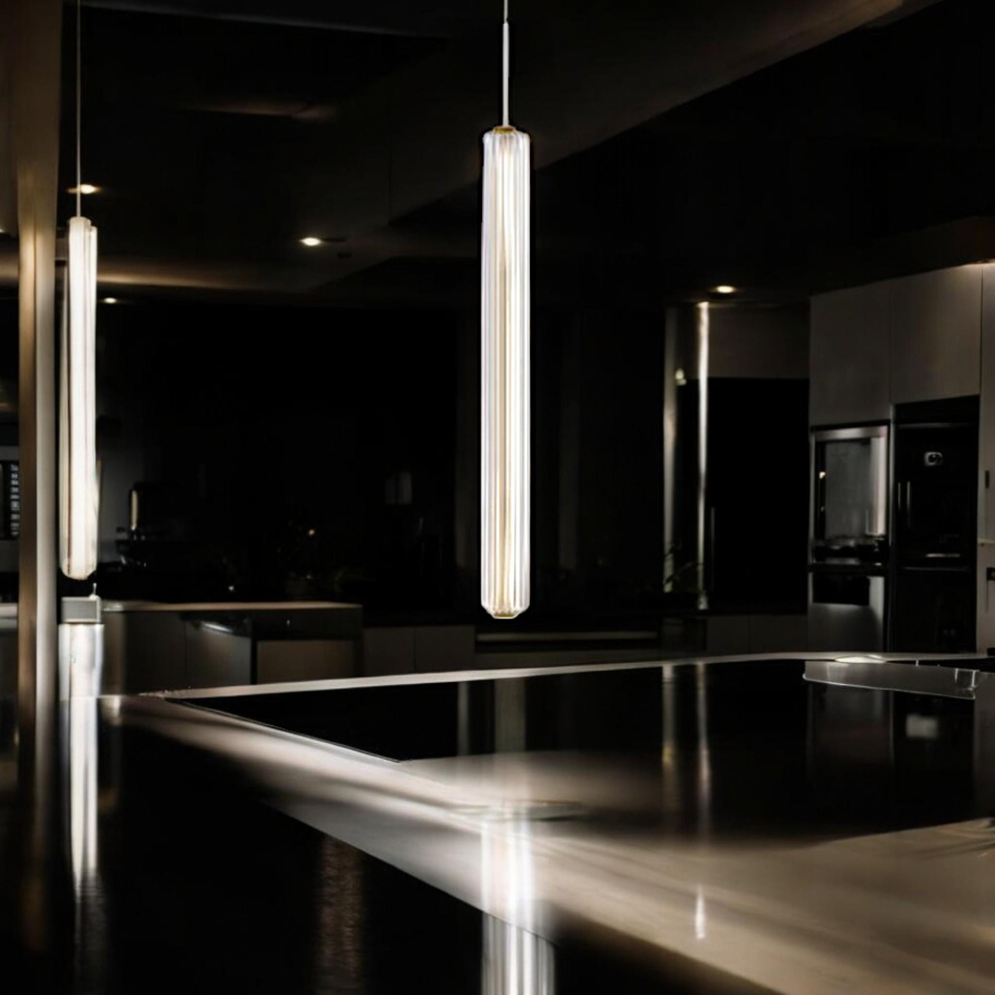 Custom glass pendant light with brass in a modern kitchen setting, showcasing unique artistry and elegant design.